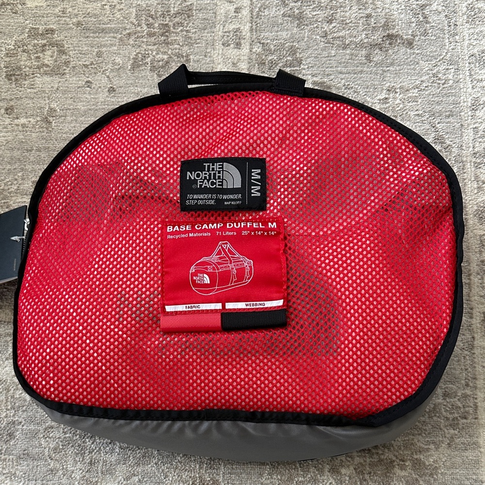 The North Face Red and Black Base Camp Duffel M. 25x14x14. NWT’s.